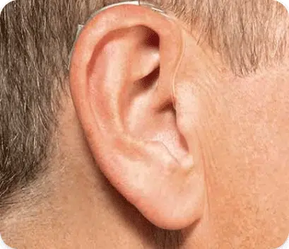 Open BTE hearing aids on man's ear